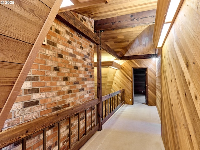 corridor featuring wood ceiling and wooden walls