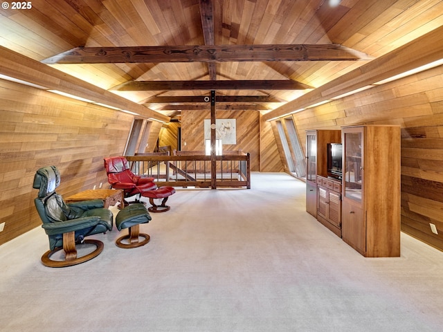 living area with wooden ceiling, light colored carpet, wood walls, and lofted ceiling with beams