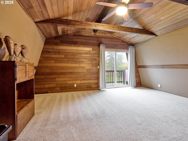 additional living space featuring wood ceiling, vaulted ceiling with beams, wooden walls, carpet flooring, and ceiling fan