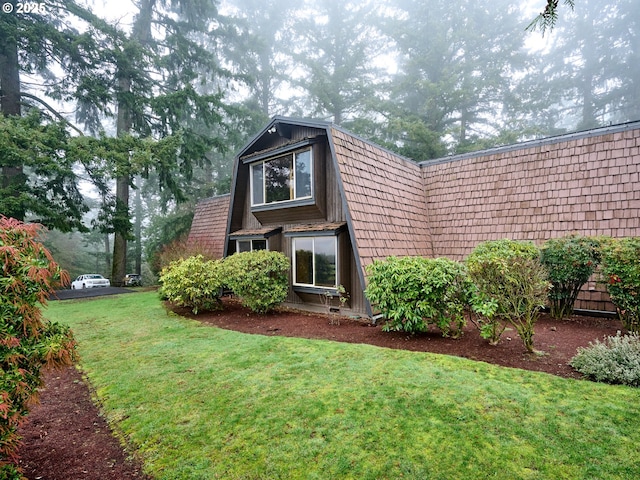 view of home's exterior with a yard