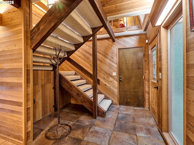 interior space featuring wooden walls