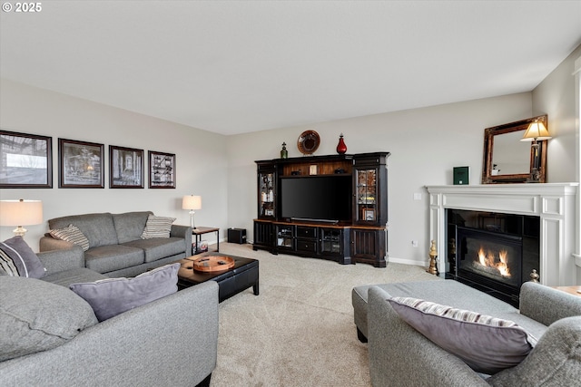 living area with carpet floors and a tile fireplace