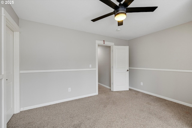 unfurnished bedroom featuring carpet, baseboards, and ceiling fan