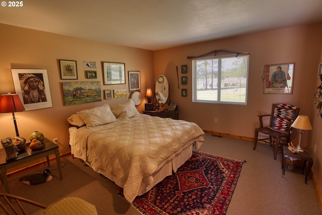 carpeted bedroom with baseboards