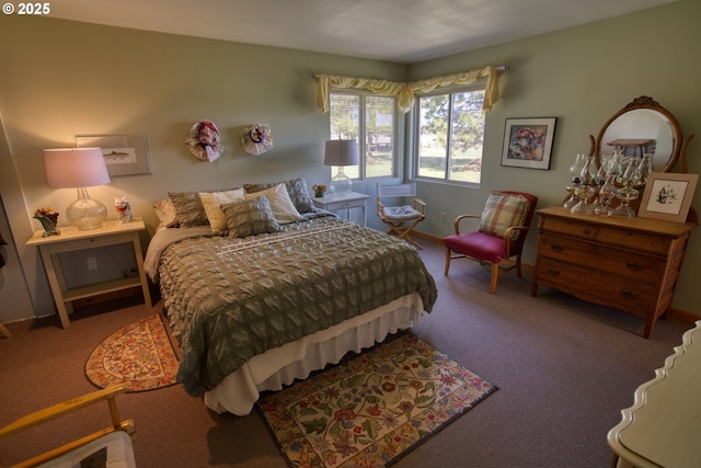 bedroom with carpet flooring and baseboards