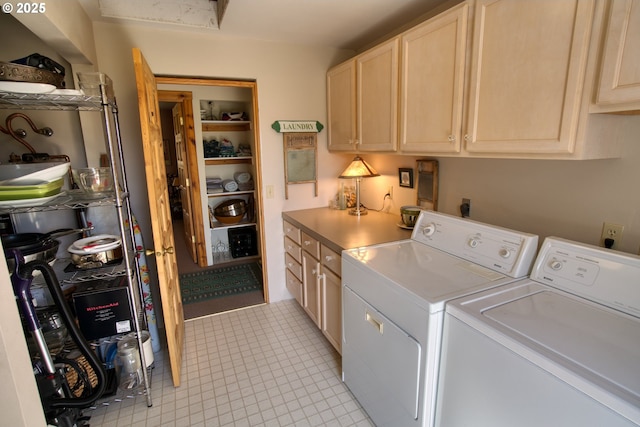 laundry room featuring separate washer and dryer, cabinet space, and light tile patterned floors