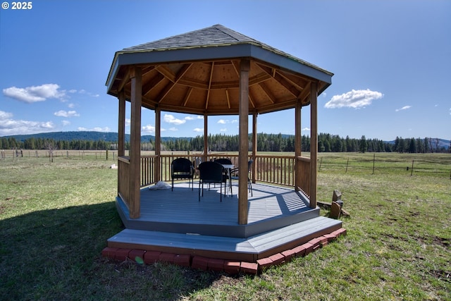 wooden deck with a gazebo and a view of rural / pastoral area