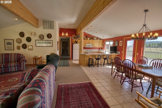 living area with a chandelier, light tile patterned floors, and recessed lighting