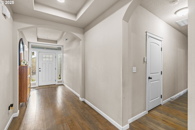 3276 S Mountain View Dr, Albany, OR 97322 - entryway featuring a tray ceiling, arched walkways, and wood-type flooring