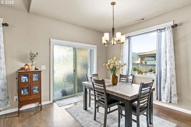 3276 S Mountain View Dr, Albany, OR 97322 - dining room with a chandelier and wood finished floors
