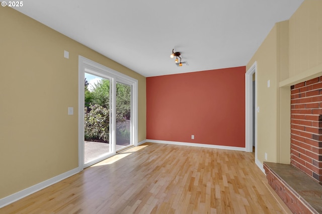2720 Taylor St, Eugene, OR 97405 - unfurnished living room with baseboards and light wood-style flooring