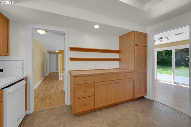2720 Taylor St, Eugene, OR 97405 - kitchen with visible vents, open shelves, baseboards, tile counters, and dishwasher