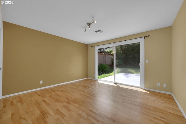 2720 Taylor St, Eugene, OR 97405 - empty room featuring visible vents, light wood-style floors, and baseboards