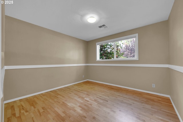 2720 Taylor St, Eugene, OR 97405 - empty room with visible vents, baseboards, and wood finished floors