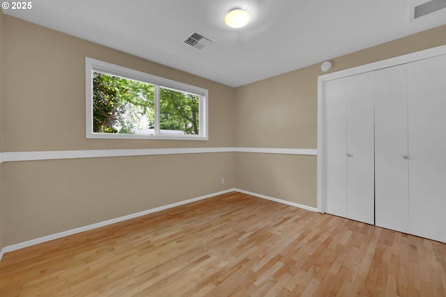 2720 Taylor St, Eugene, OR 97405 - unfurnished bedroom with baseboards, wood finished floors, and visible vents