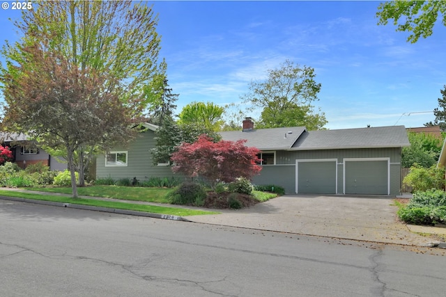 2720 Taylor St, Eugene, OR 97405 - view of front facade featuring an attached garage, driveway, and a chimney