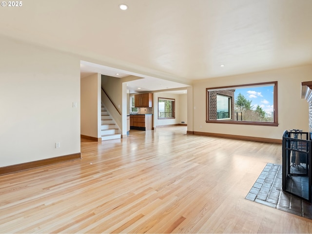 unfurnished living room with light hardwood / wood-style floors