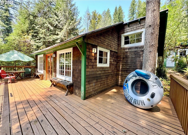 26015 NE Lucia Falls Rd, Yacolt, WA 98675 - wooden deck with french doors and outdoor dining space