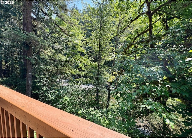 26015 NE Lucia Falls Rd, Yacolt, WA 98675 - wooden deck featuring a wooded view