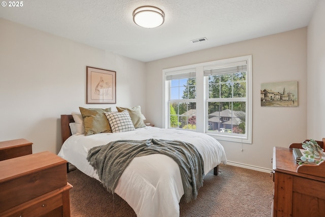 carpeted bedroom featuring baseboards
