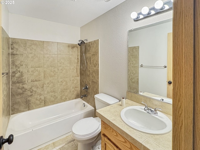 full bathroom featuring toilet, vanity, and tiled shower / bath combo