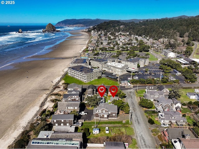 aerial view featuring a view of the beach and a water view