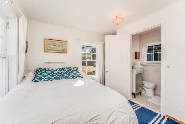 bedroom featuring connected bathroom