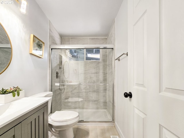 4145 SE Grant St, Portland, OR 97214 - bathroom with vanity, toilet, and a shower stall