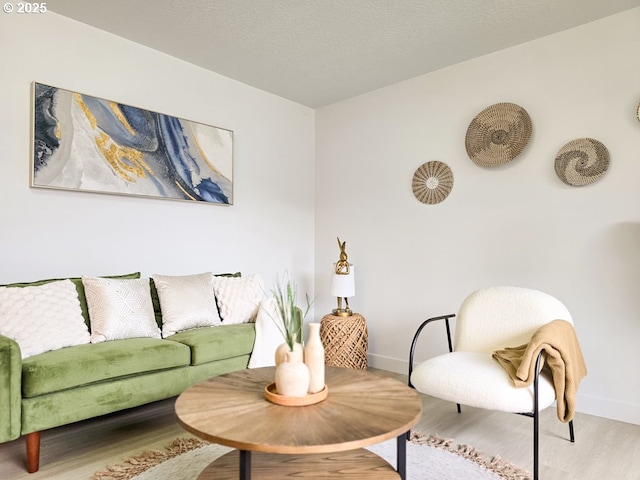 4145 SE Grant St, Portland, OR 97214 - living room featuring baseboards and wood finished floors