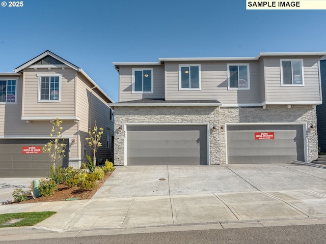 908 NW 178th Way, Ridgefield, WA 98642 - view of front facade with stone siding, an attached garage, and concrete driveway