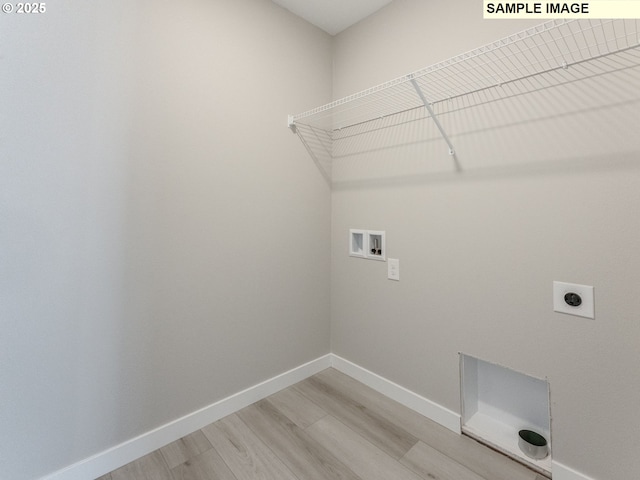 908 NW 178th Way, Ridgefield, WA 98642 - washroom with washer hookup, light wood-type flooring, hookup for an electric dryer, and baseboards