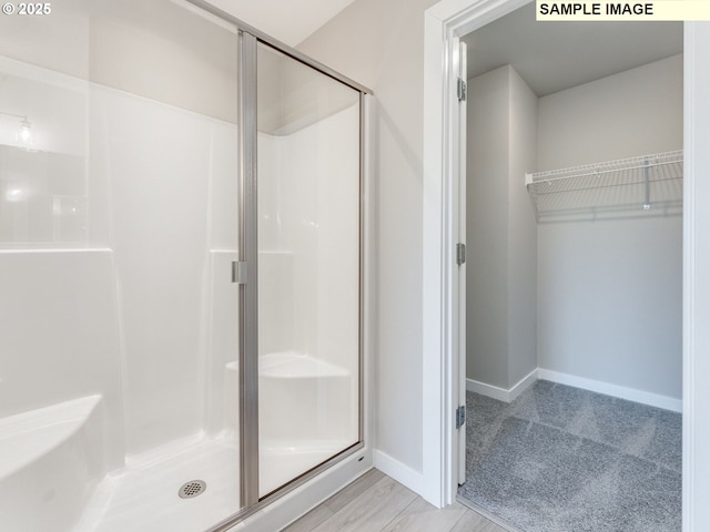 908 NW 178th Way, Ridgefield, WA 98642 - full bath featuring a stall shower, baseboards, and a walk in closet