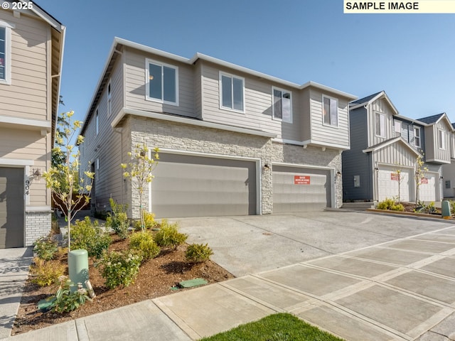 908 NW 178th Way, Ridgefield, WA 98642 - townhome / multi-family property with stone siding, a garage, and concrete driveway
