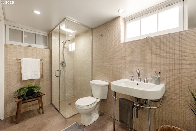 6416 NE 23rd Ave, Portland, OR 97211 - bathroom with tile walls, a shower stall, and tile patterned flooring
