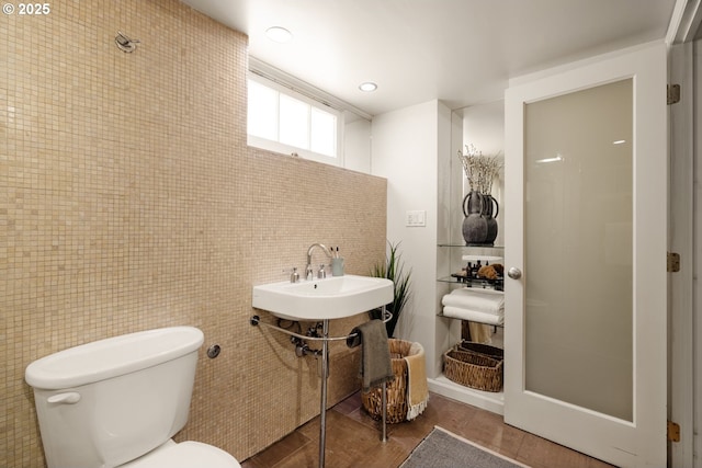 6416 NE 23rd Ave, Portland, OR 97211 - bathroom with wood finished floors and tile walls