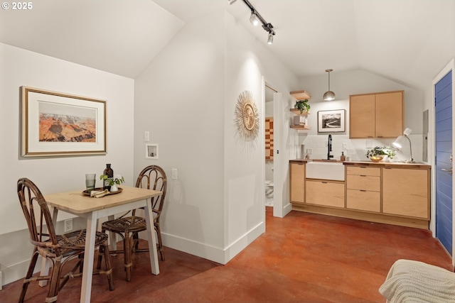 6416 NE 23rd Ave, Portland, OR 97211 - dining room with vaulted ceiling, concrete floors, and rail lighting