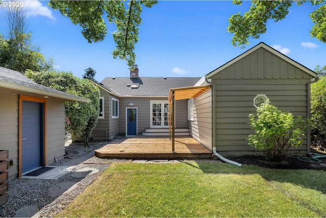 6416 NE 23rd Ave, Portland, OR 97211 - back of property featuring a wooden deck, a lawn, a chimney, french doors, and board and batten siding