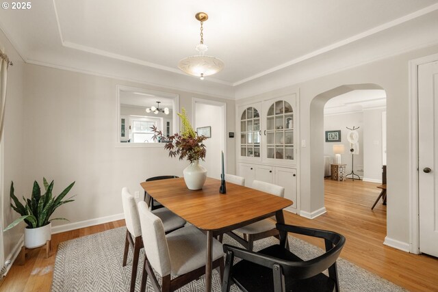 6416 NE 23rd Ave, Portland, OR 97211 - dining space featuring arched walkways and light wood-style floors