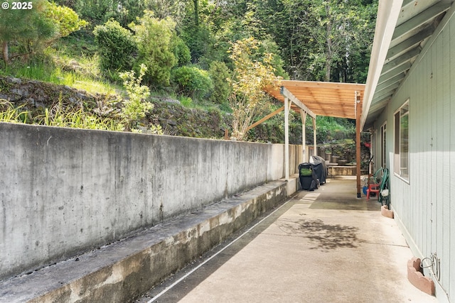 view of patio / terrace featuring fence