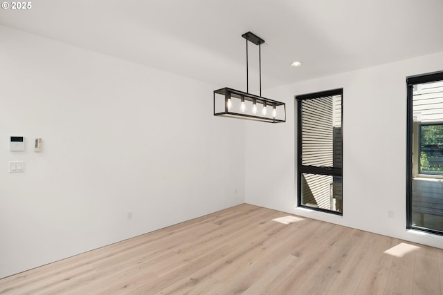 unfurnished dining area featuring light hardwood / wood-style flooring