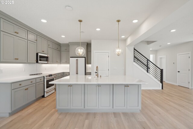 11506 NE 51st Ave, Vancouver, WA 98686 - kitchen with white appliances, gray cabinetry, light wood finished floors, and light countertops