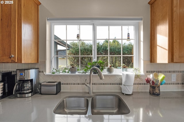 kitchen with tasteful backsplash and sink