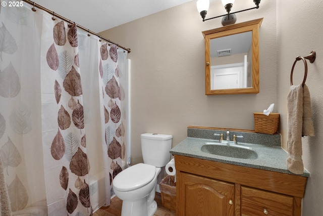 full bathroom with vanity, toilet, and shower / tub combo with curtain