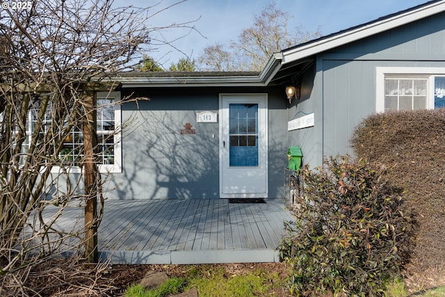 property entrance with a deck