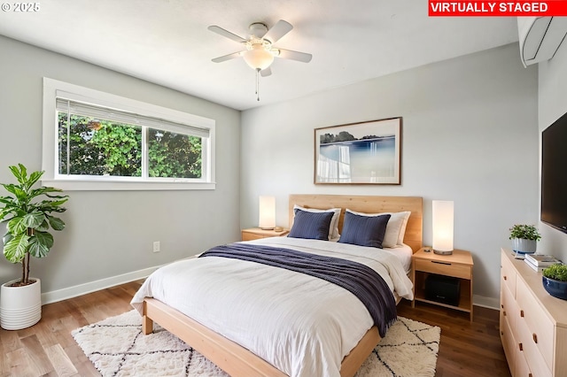 704 SE 207th Ave, Gresham, OR 97030 - bedroom featuring wood finished floors, an AC wall unit, and ceiling fan