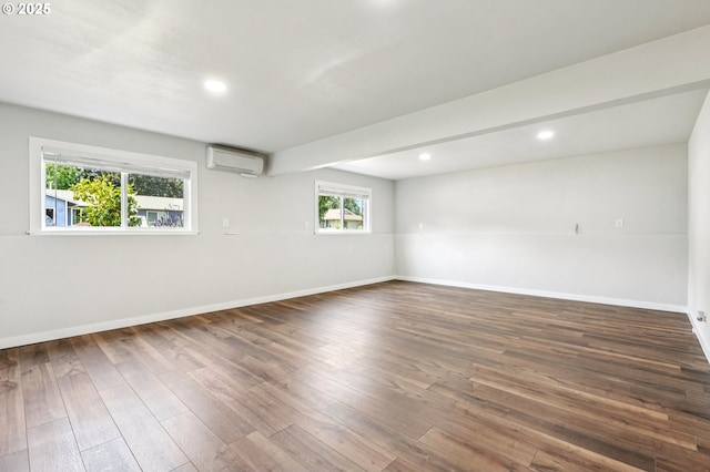 704 SE 207th Ave, Gresham, OR 97030 - unfurnished room with an AC wall unit, wood finished floors, and recessed lighting