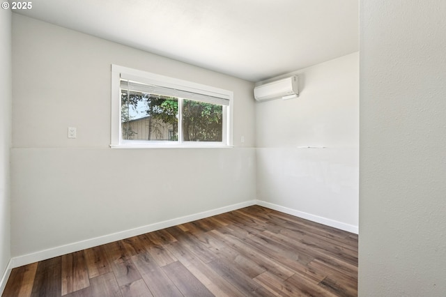 704 SE 207th Ave, Gresham, OR 97030 - unfurnished room featuring a wall mounted AC and wood finished floors