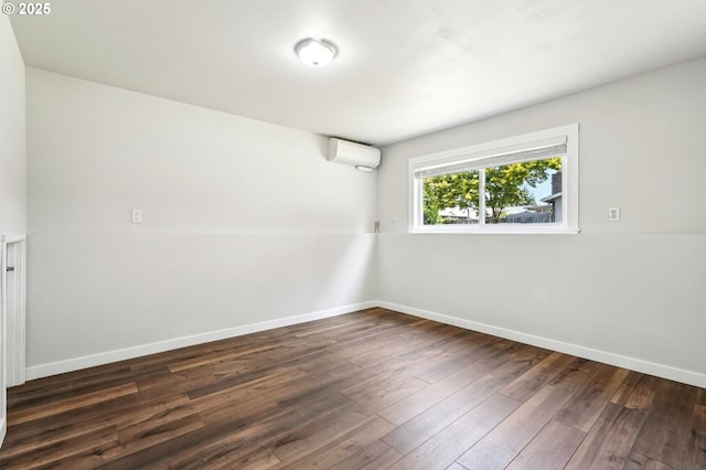 704 SE 207th Ave, Gresham, OR 97030 - empty room with a wall unit AC and dark wood-style floors