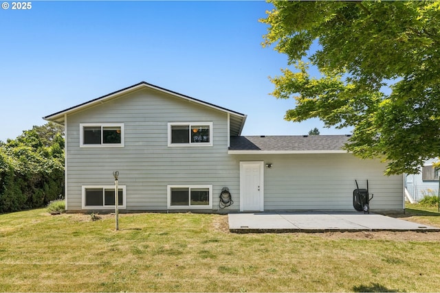 704 SE 207th Ave, Gresham, OR 97030 - rear view of property with a patio, a yard, and a shingled roof