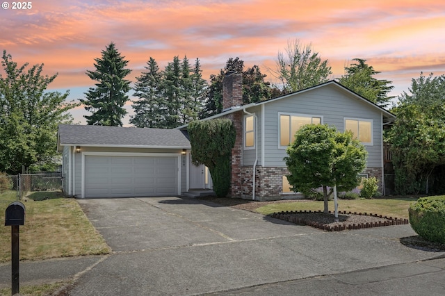 704 SE 207th Ave, Gresham, OR 97030 - view of front facade with a chimney, driveway, brick siding, and an attached garage